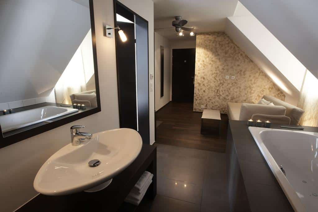 Attic-style room with spa bath and cozy seating area