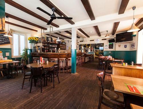 Casual bar and restaurant with wooden floors and rustic decor