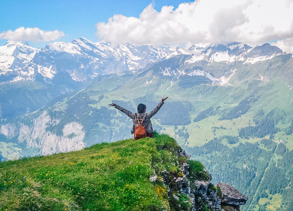 Hiker enjoying mountain view on Lauterbrunnen to Wengen hike