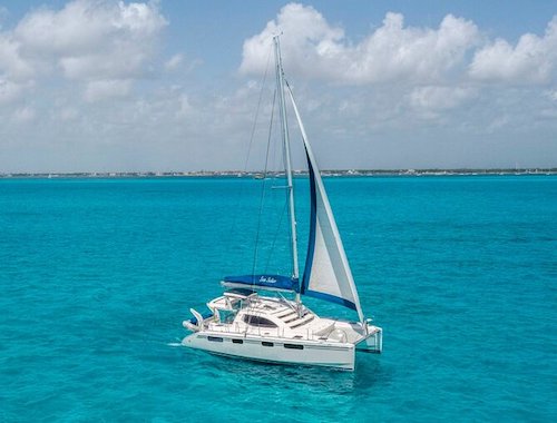 Isla Mujeres Catamaran Tour with Snorkel Open bar and Transportation from hotel