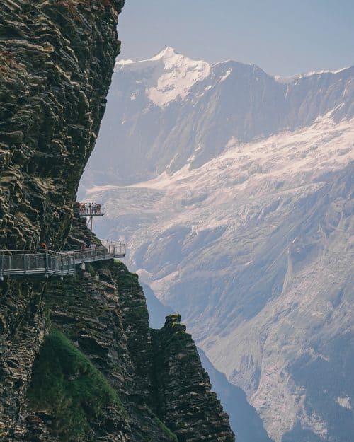 Via ferrata, cliff walk in Grindelwald with people on ledge