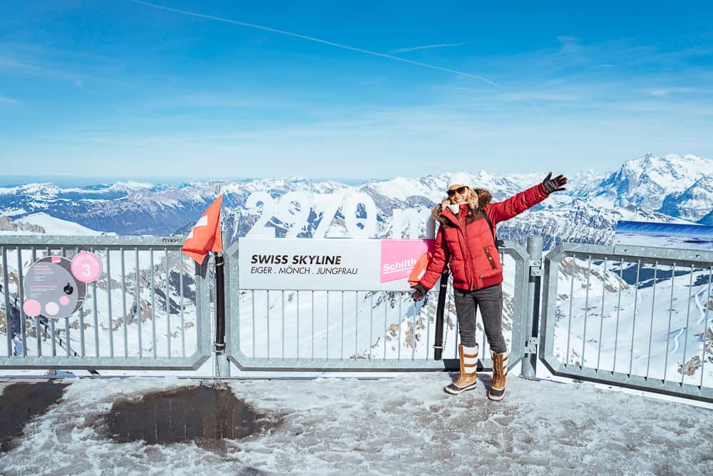 Tourist posing at top of Mount Schilthorn