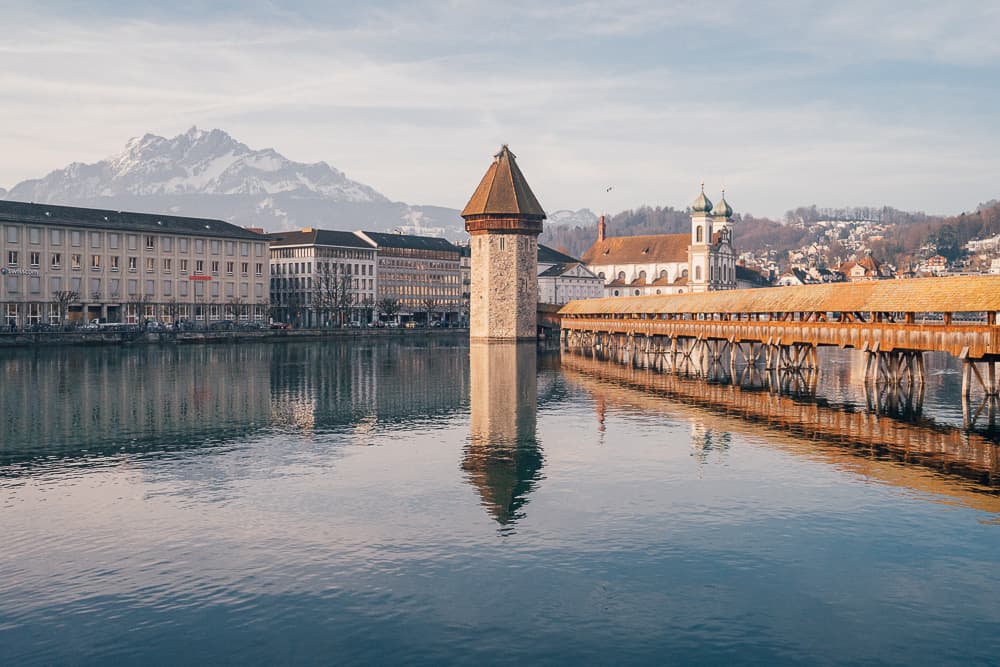 How To Get To Lauterbrunnen, Switzerland (2025 Guide) 10 Lucerne’s Chapel Bridge with mountains in the background