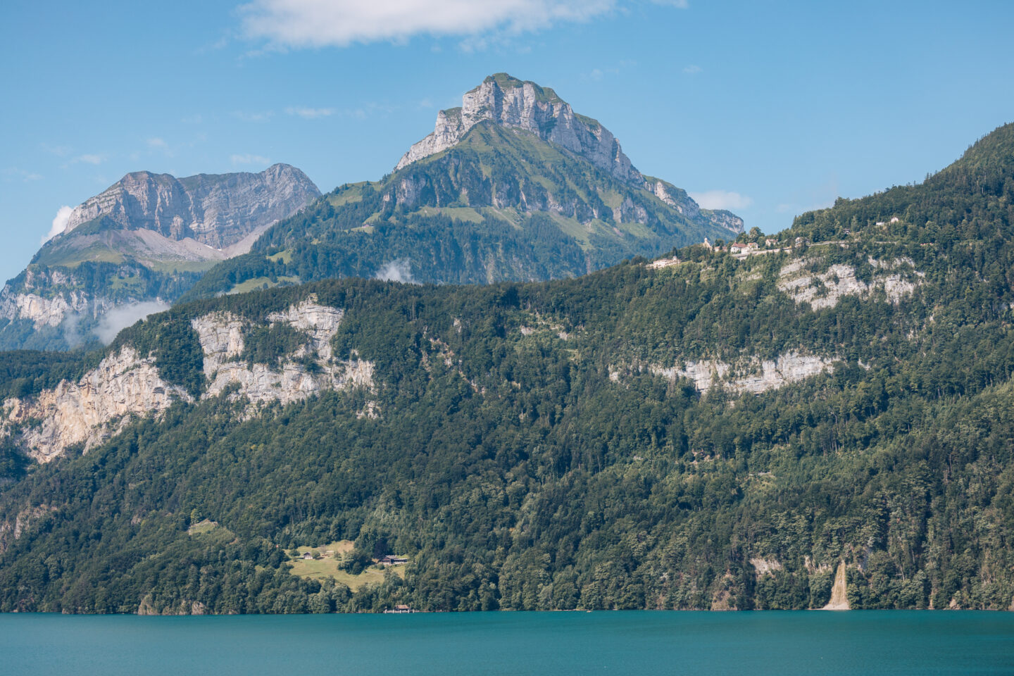 Mountains rising above Lake Lucerne on sunny day