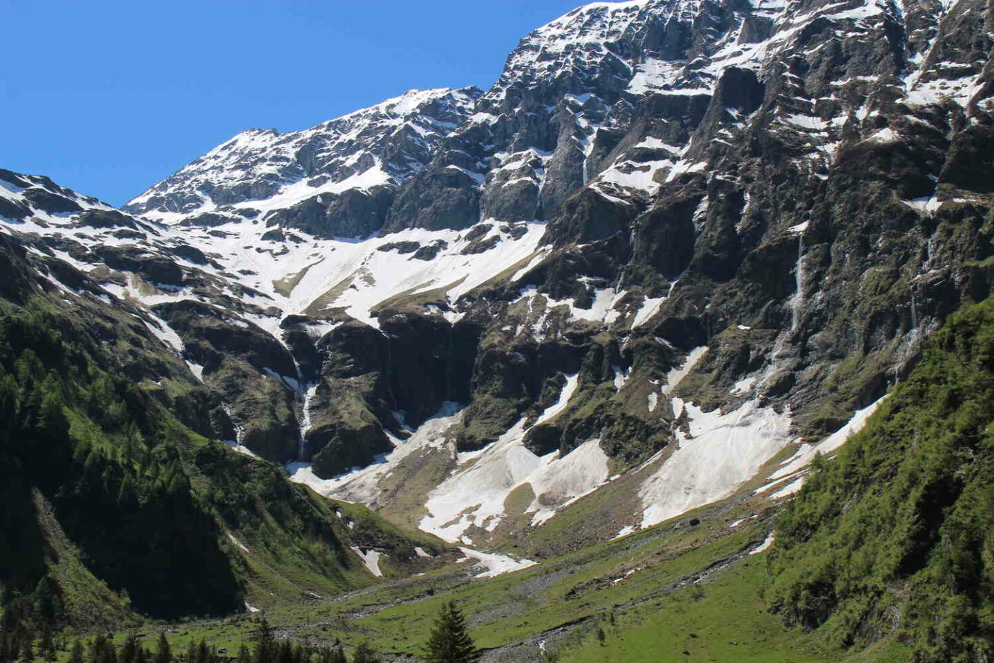 Snowy alpine basin on Lauterbrunnen hiking trail