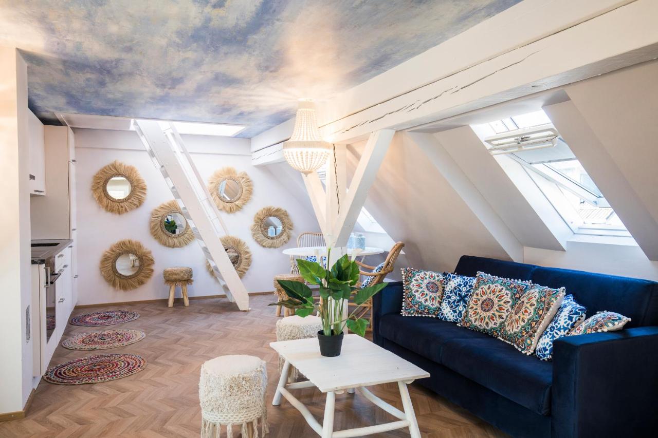 Artistic loft with mirrors, beams, and colorful decor