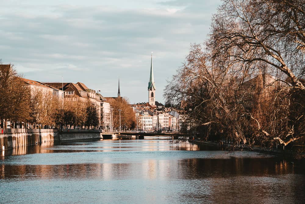 Zurich city river view with church and bridge